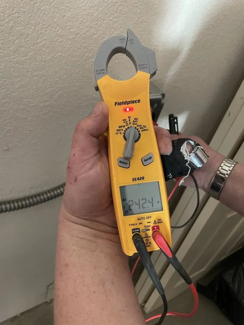 Voltage testing with clamp meter during Outlet Installation in Hatfield